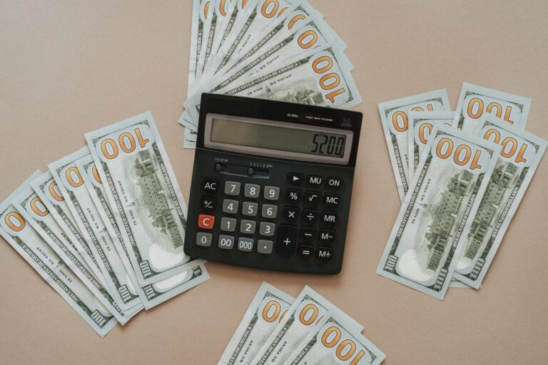 Photo of Calculator Near Dollar Bills. Learn how to make $100
