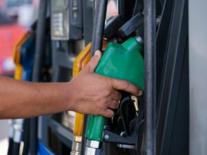 A Person's Hand Holding a Gas Pump